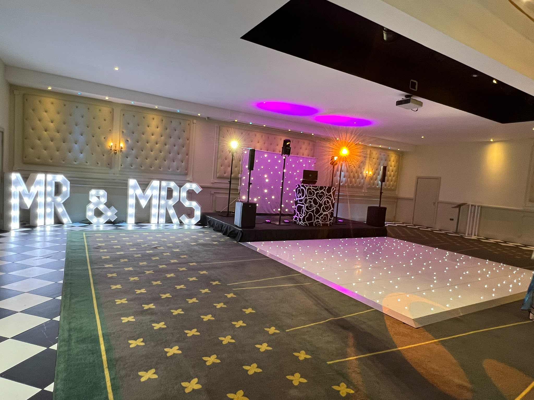 White LED starlit dance floor with MR & MRS light-up letters at a Sussex wedding